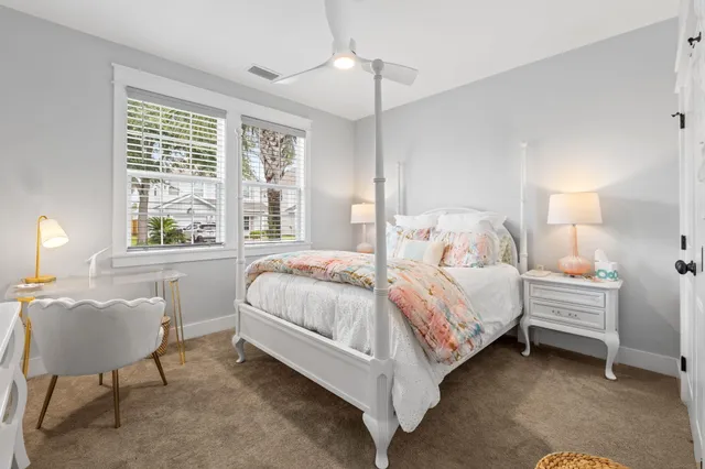 a bed room with a bed and a chair