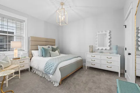 a bed room with a bed and a dresser