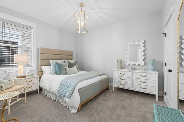 a bed room with a bed and a dresser