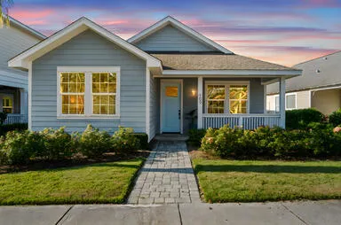 a front view of a house with garden