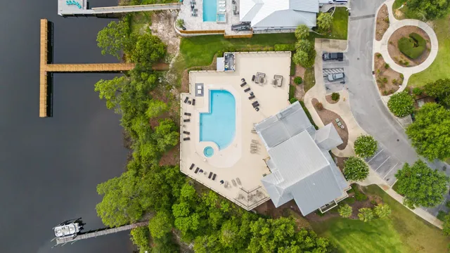 an aerial view of residential house with outdoor space and swimming pool