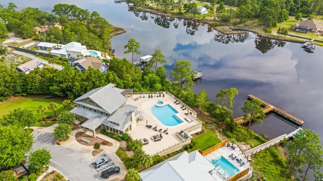 an aerial view of a house with a yard and garden