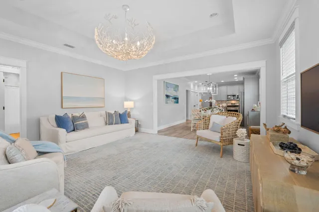 a living room with furniture and a large mirror