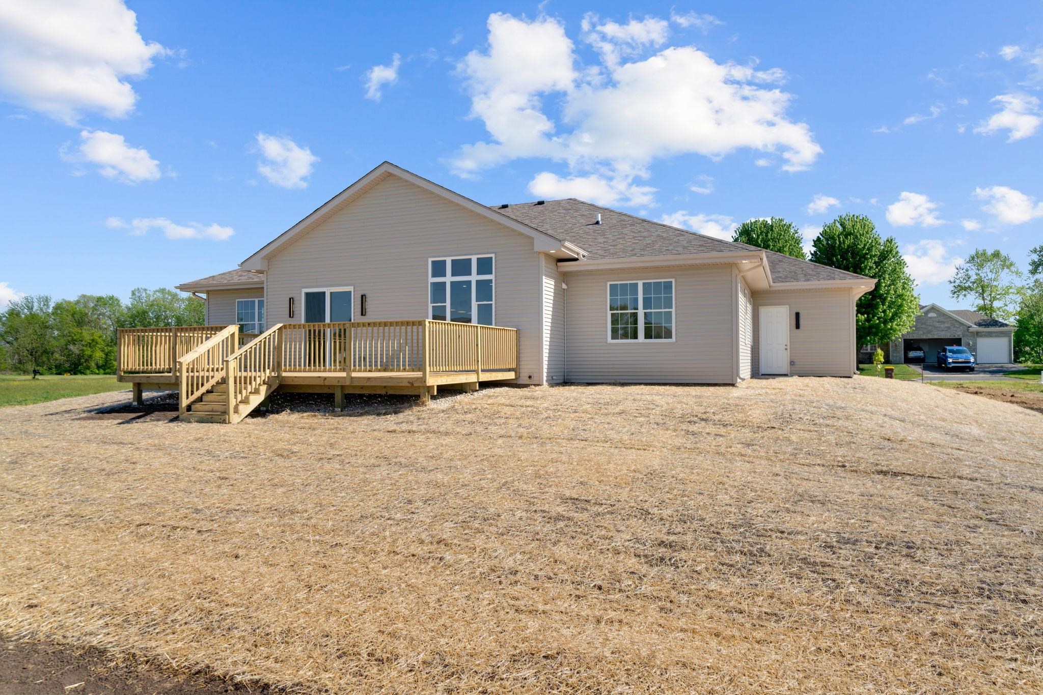 5145 Sycamore Ridge Road Belvidere, IL 61008 - Photo 48 of 57 a view of a house with a yard