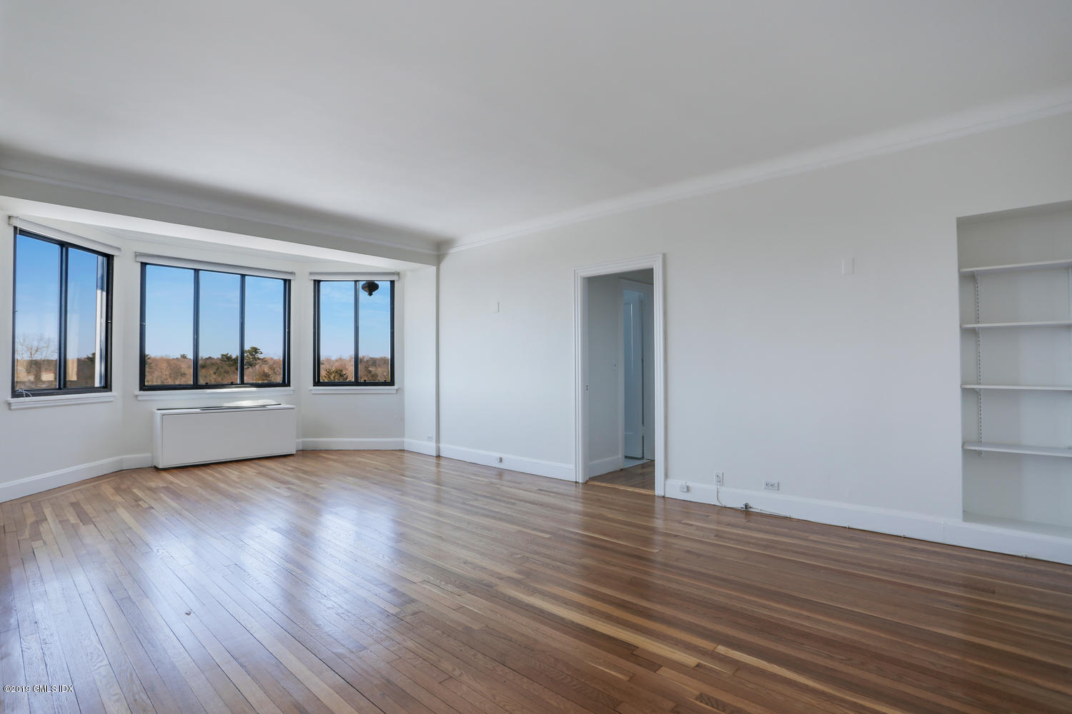 47 Lafayette Place, Unit 5D Greenwich, CT 06830 - Photo 2 of 11 a view of an empty room and wooden floor