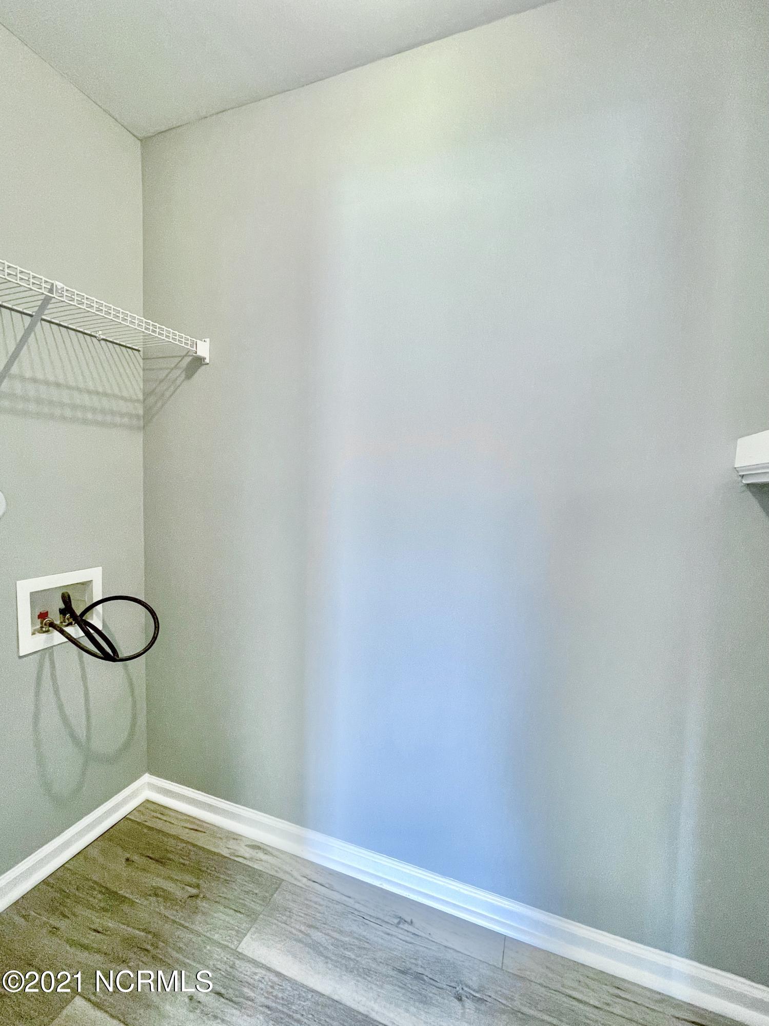 4532 Alder Ridge Road Wilmington, NC 28412 - Photo 21 of 48 Generous laundry/ storage room off kitchen.