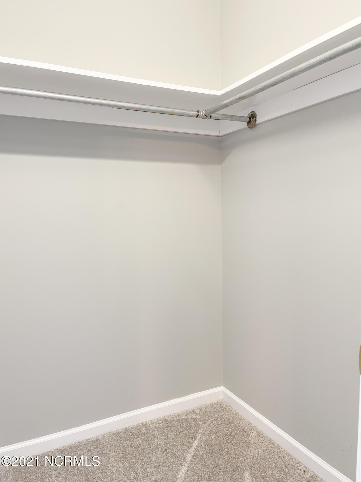 4532 Alder Ridge Road Wilmington, NC 28412 - Photo 27 of 48 Walk in closet in primary bedroom.