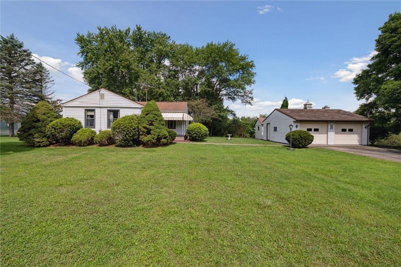 433 Bunker Hill Road Kittanning, PA 16201 - Photo 1 of 42 a front view of a house with garden