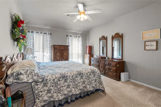 a bed room with a bed and a dresser