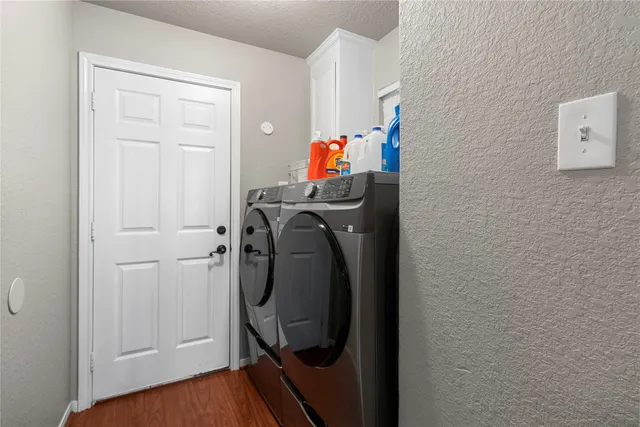 a view of storage and utility room with washer and dryer