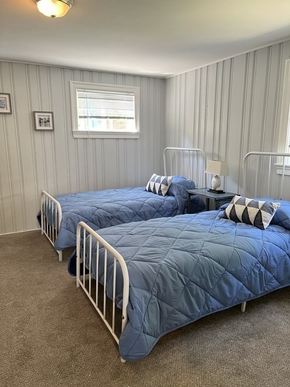 21 Blaney Street, Unit 1 Swampscott, MA 01907 - Photo 18 of 24 a bedroom with two beds and a window