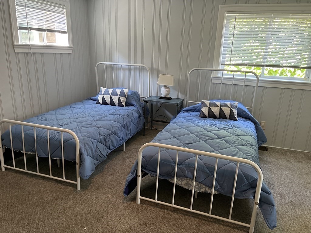 21 Blaney Street, Unit 1 Swampscott, MA 01907 - Photo 19 of 24 a bedroom with two beds and a window
