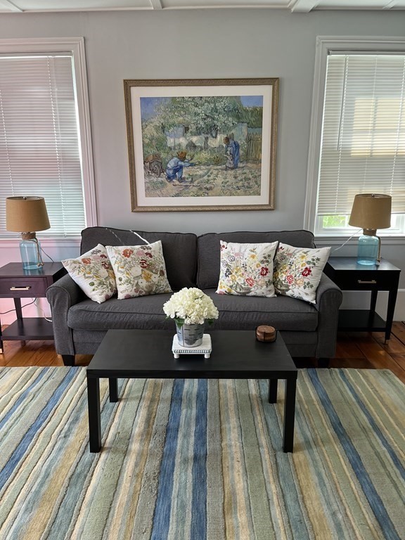 21 Blaney Street, Unit 1 Swampscott, MA 01907 - Photo 4 of 24 a living room with furniture and a wooden floor