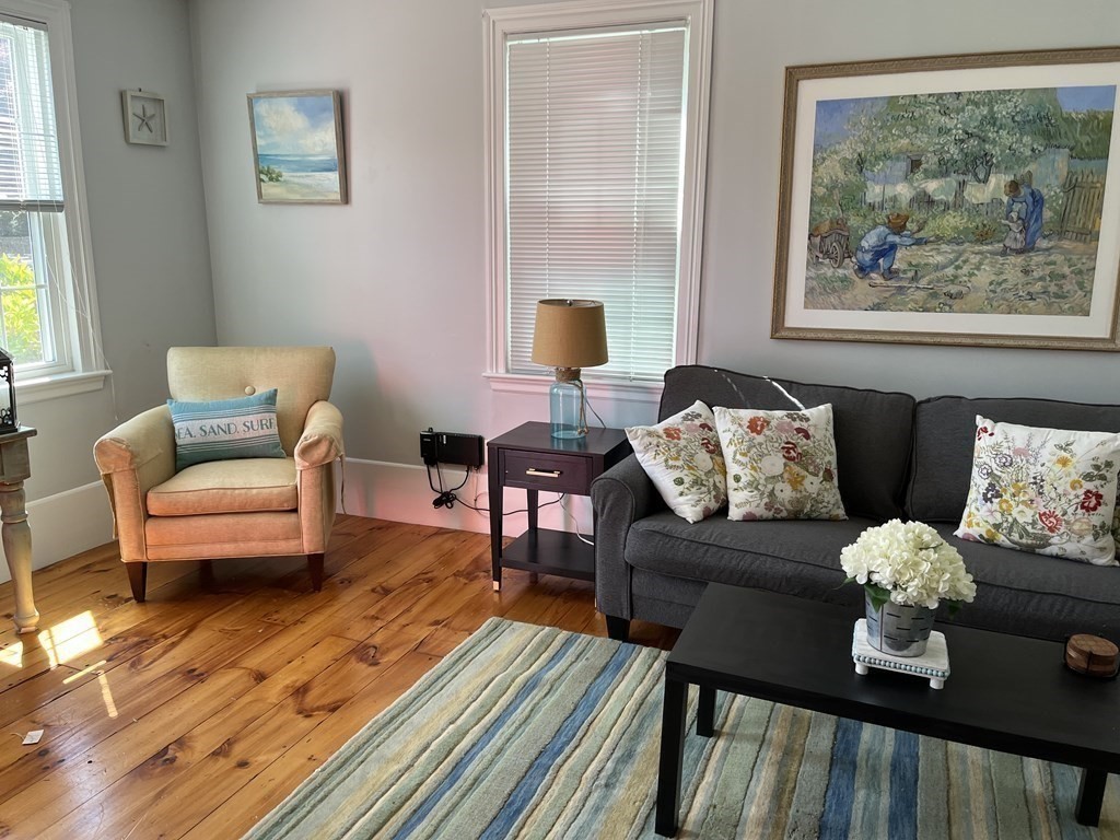 21 Blaney Street, Unit 1 Swampscott, MA 01907 - Photo 5 of 24 a living room with furniture and wooden floor