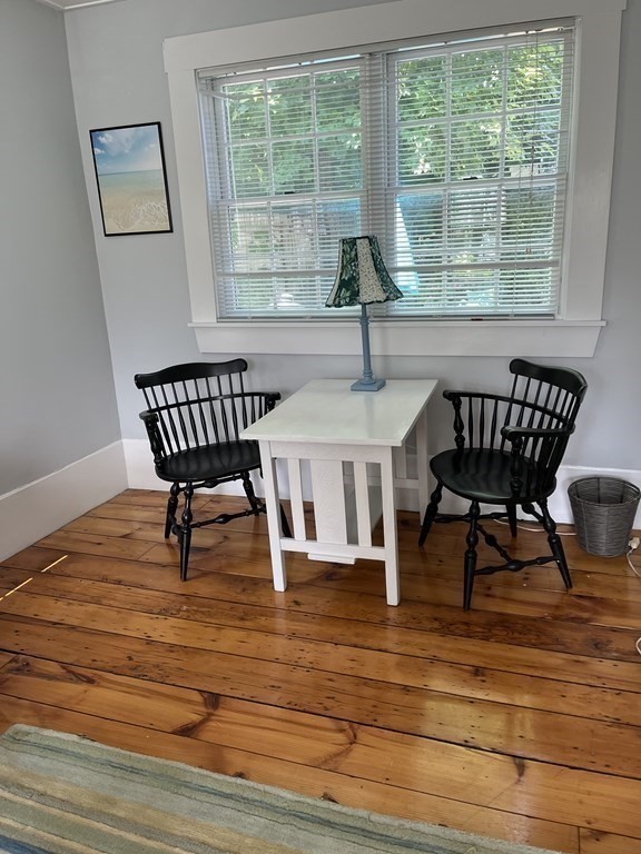 21 Blaney Street, Unit 1 Swampscott, MA 01907 - Photo 6 of 24 a view of a dining room with furniture a chandelier and wooden floor