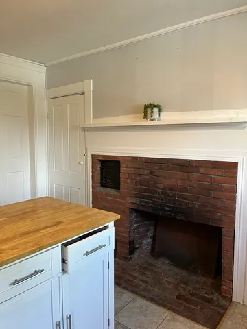 a view of fireplace and utility room