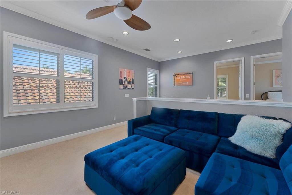 5769 Mango Circle Naples, FL 34110 - Photo 11 of 42 a living room with furniture and a window