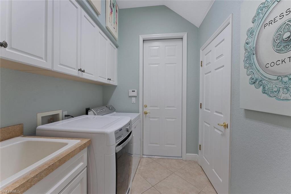 5769 Mango Circle Naples, FL 34110 - Photo 12 of 42 a utility room with dryer and washer