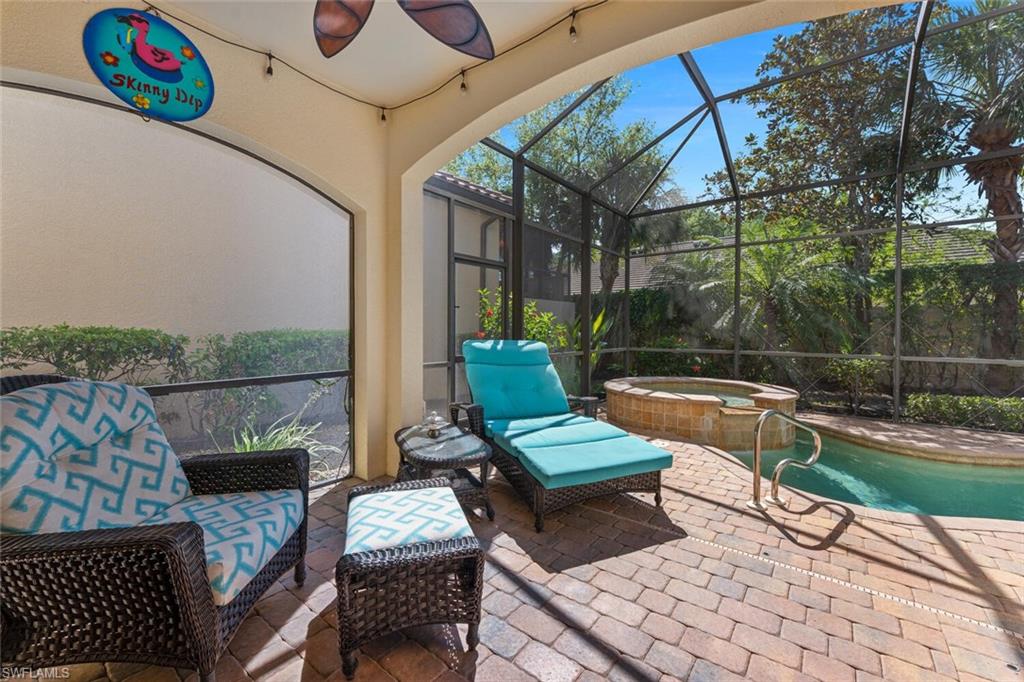 5769 Mango Circle Naples, FL 34110 - Photo 14 of 42 a view of a chairs and table in the patio