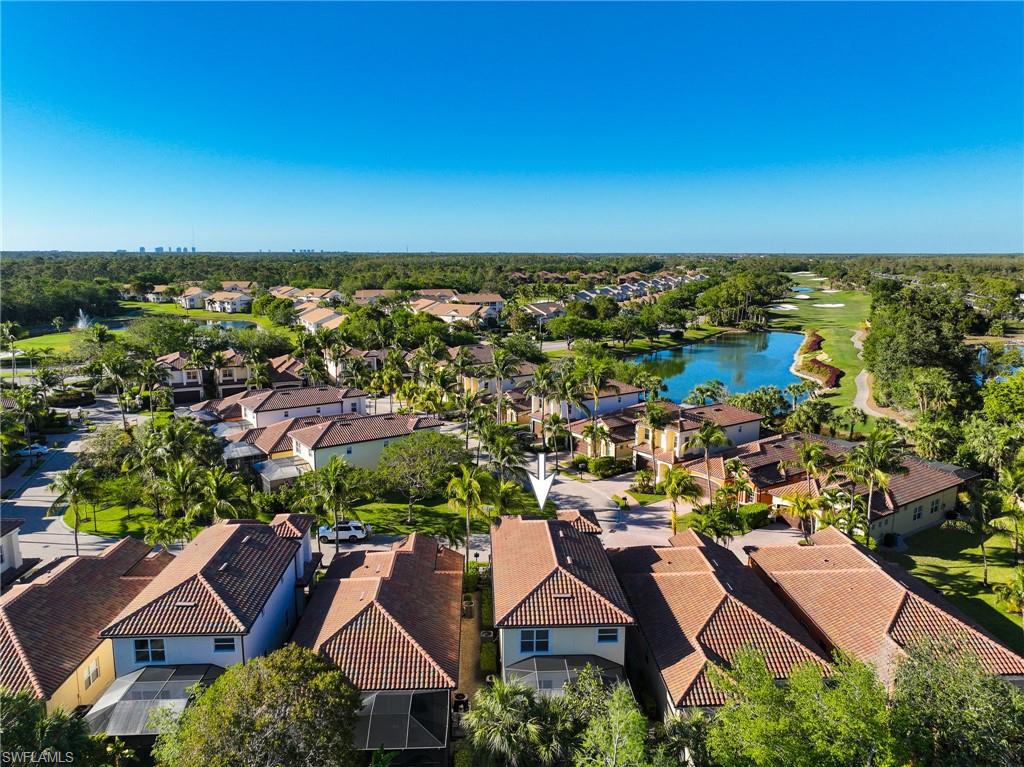5769 Mango Circle Naples, FL 34110 - Photo 17 of 42 an aerial view of residential houses with outdoor space and trees