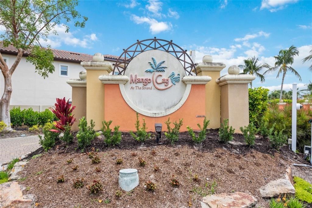 5769 Mango Circle Naples, FL 34110 - Photo 18 of 42 a front view of a house with garden