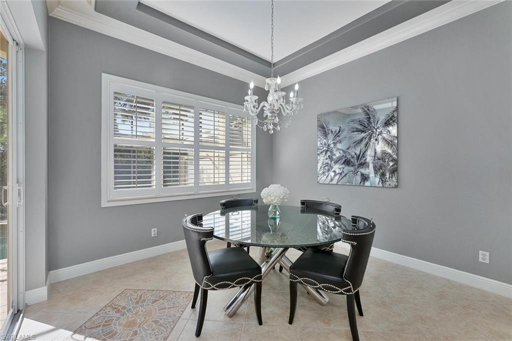 5769 Mango Circle Naples, FL 34110 - Photo 3 of 42 a dining room with furniture and window