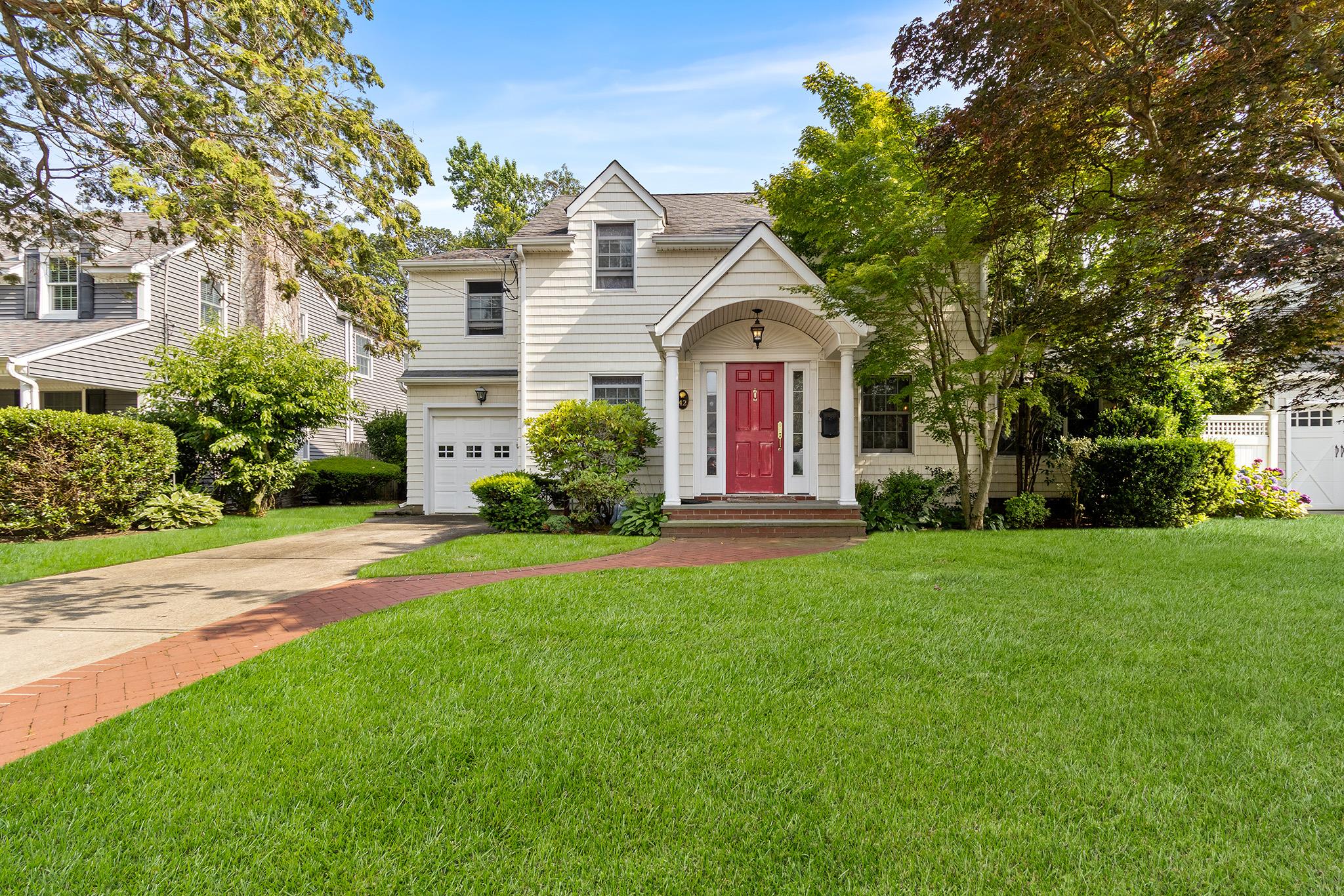 front view of a house with a yard
