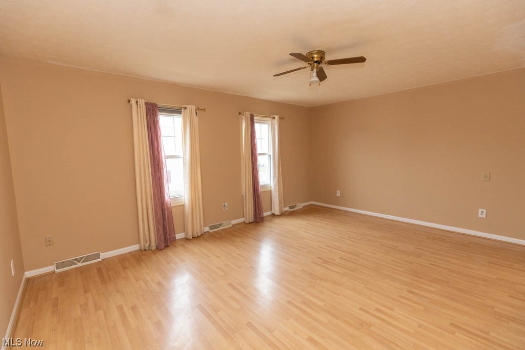 4376 Archer Road Cleveland, OH 44105 - Photo 16 of 30 Unfurnished room featuring light wood-type flooring and ceiling fan