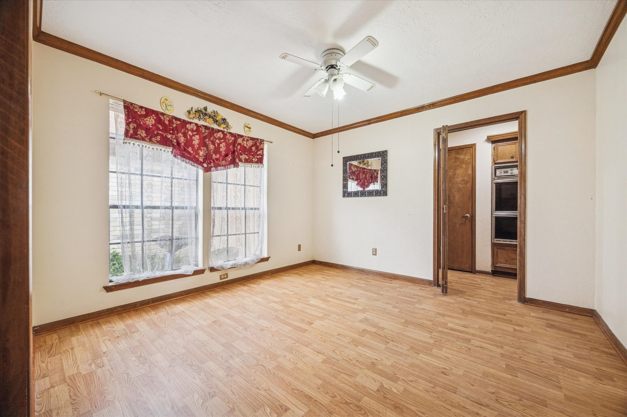 15427 Rio Plaza Drive Houston, TX 77083 - Photo 15 of 16 an empty room with fan and windows