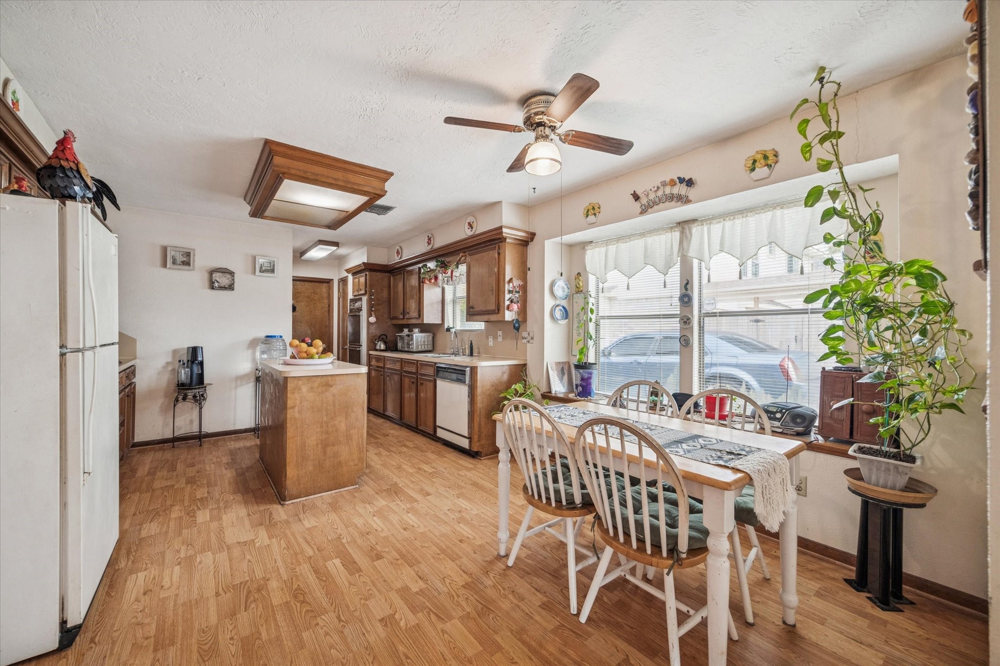 15427 Rio Plaza Drive Houston, TX 77083 - Photo 8 of 16 a view of a dining room with furniture window and wooden floor