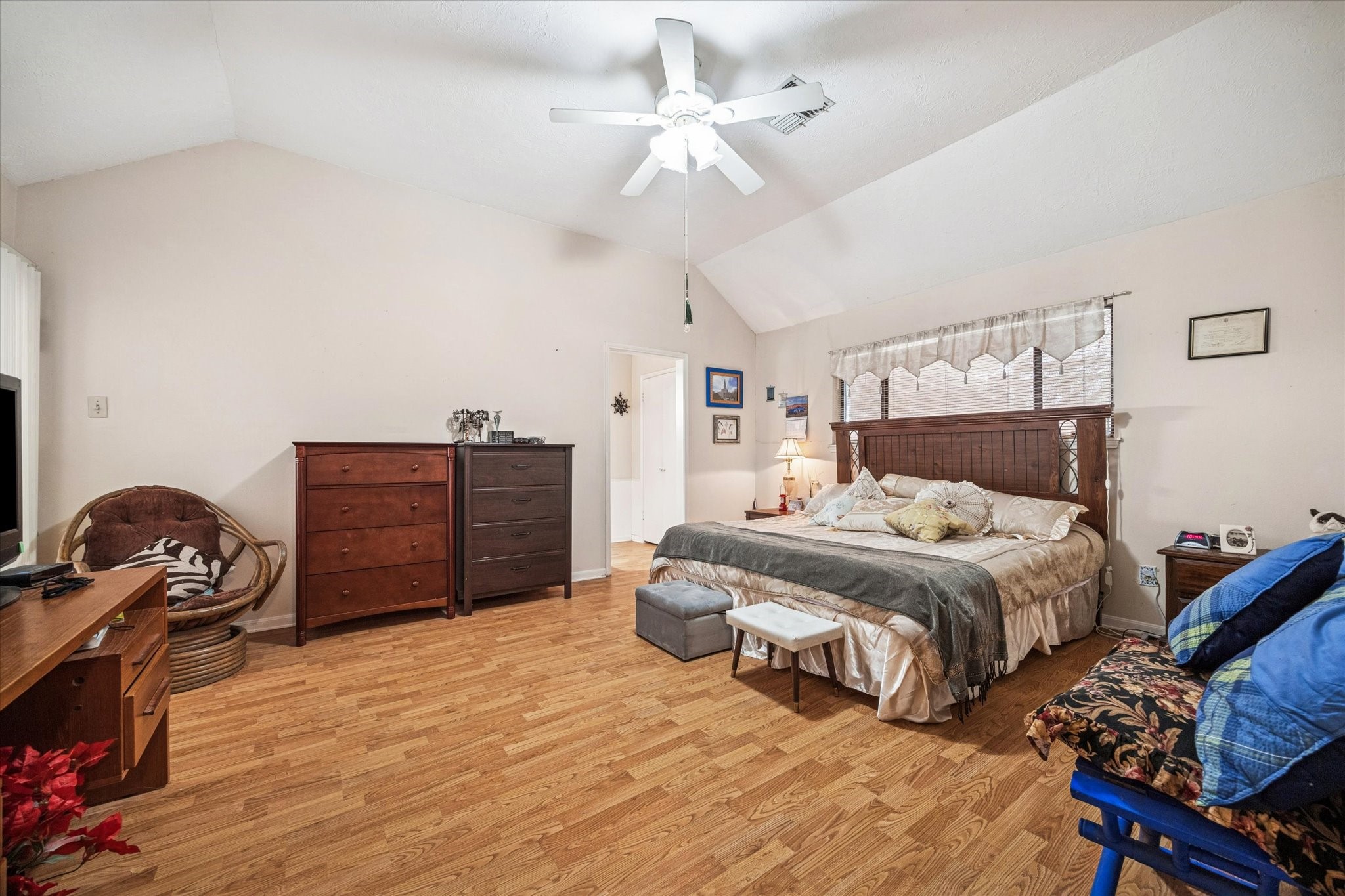 15427 Rio Plaza Drive Houston, TX 77083 - Photo 9 of 16 a bedroom with a bed and a dresser
