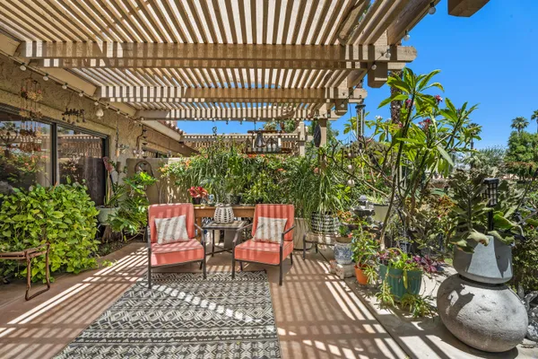 a chairs and a table in a patio