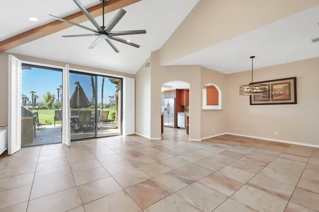 a view of a livingroom with a flat screen tv and furniture