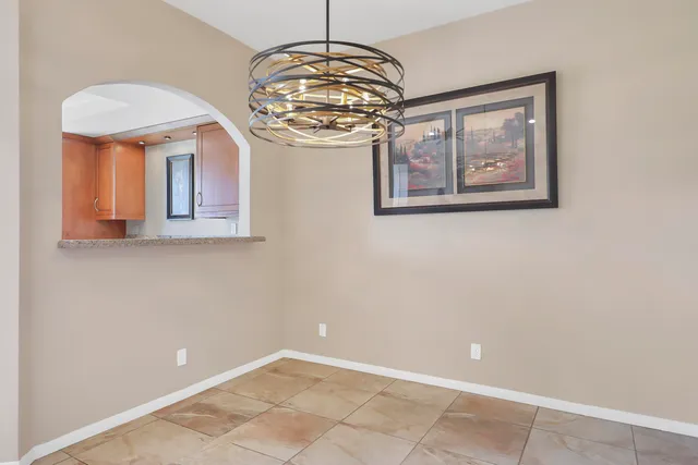 a view of a hallway with a chandelier