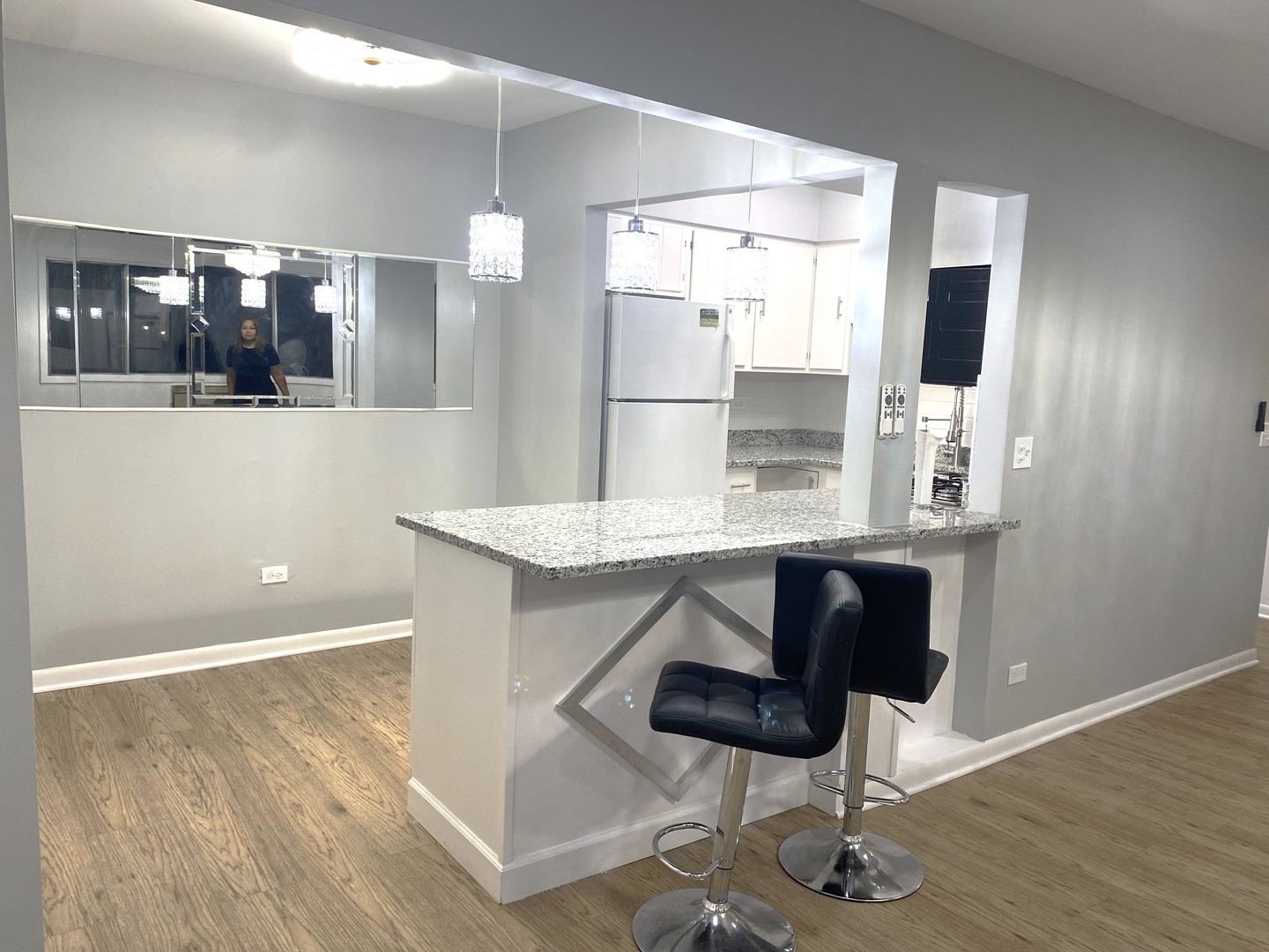 1415 West Pratt Boulevard, Unit 407 Chicago, IL 60626 - Photo 8 of 10 a kitchen with a sink cabinets and wooden floor