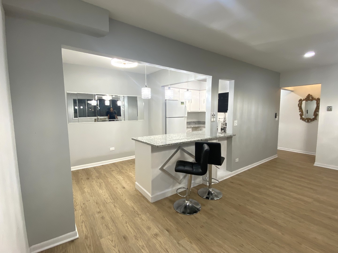 1415 West Pratt Boulevard, Unit 407 Chicago, IL 60626 - Photo 9 of 10 a view of kitchen with dining area and chandelier