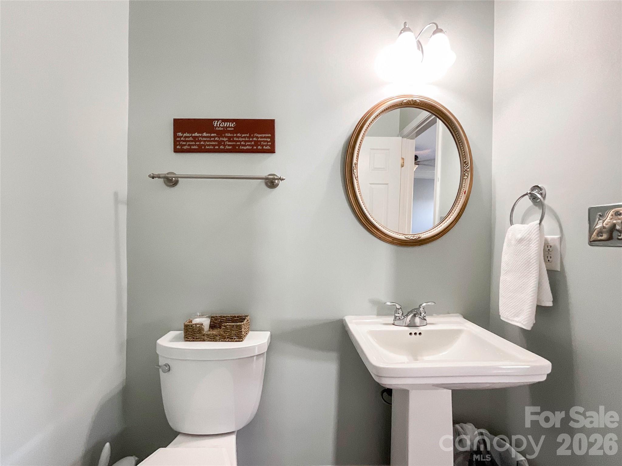 1007 Matilda Lane Indian Trail, NC 28079 - Photo 13 of 43 a bathroom with a toilet sink and mirror