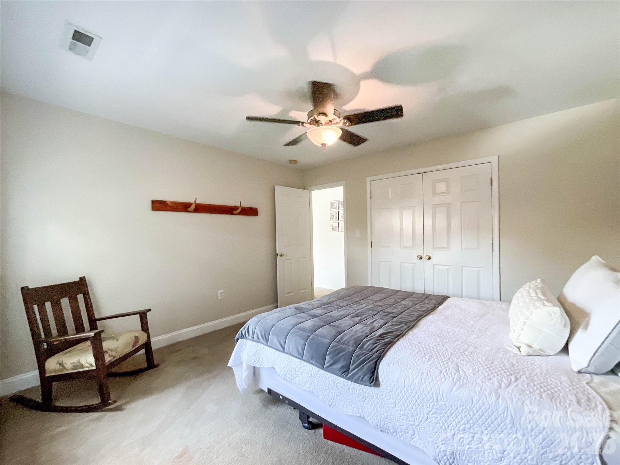 1007 Matilda Lane Indian Trail, NC 28079 - Photo 26 of 43 a bedroom with a bed and a chair