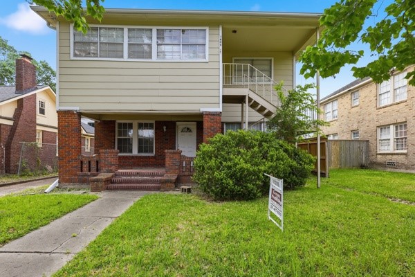 1655 Hawthorne Street Houston, TX 77006 - Photo 1 of 39 a house view with a garden space