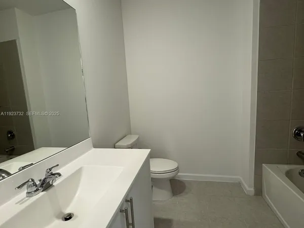 a bathroom with a sink and toilet