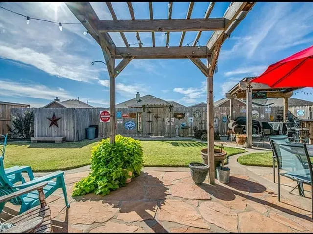 a view of yard with patio