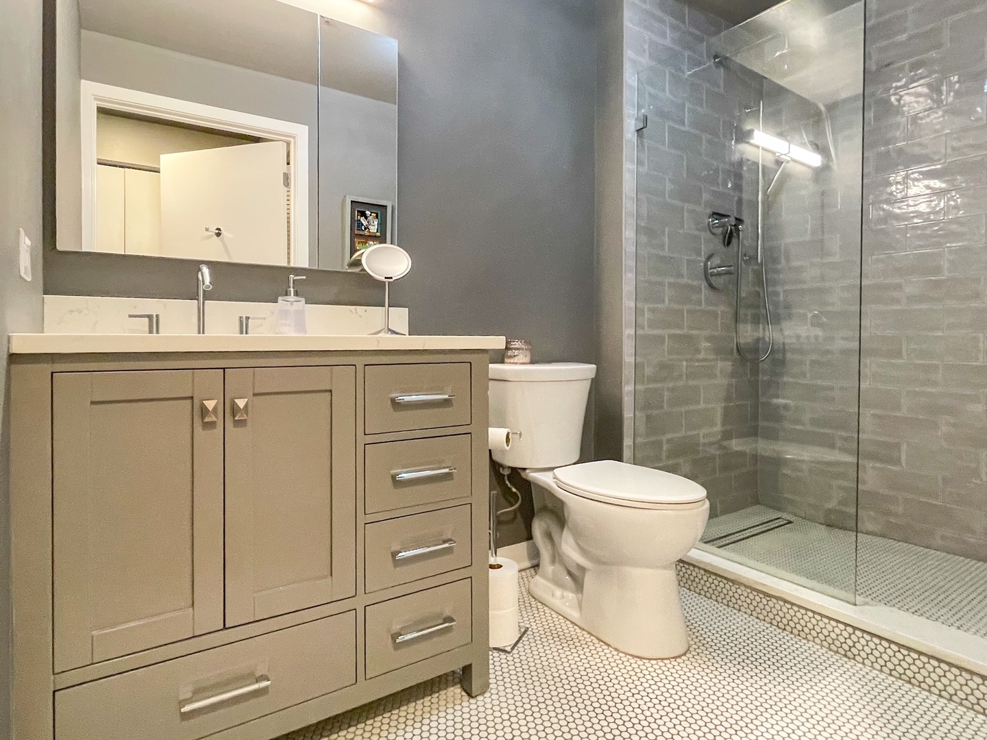 909 West Washington Boulevard, Unit 510 Chicago, IL 60607 - Photo 12 of 16 a bathroom with a sink toilet and shower