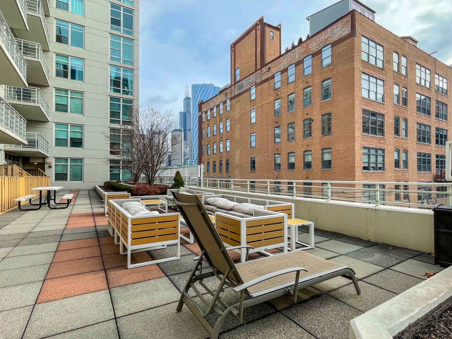 909 West Washington Boulevard, Unit 510 Chicago, IL 60607 - Photo 3 of 16 a view of a building with outdoor seating