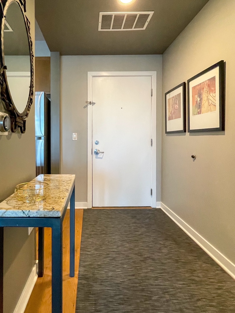 909 West Washington Boulevard, Unit 510 Chicago, IL 60607 - Photo 9 of 16 a view of a workspace with furniture