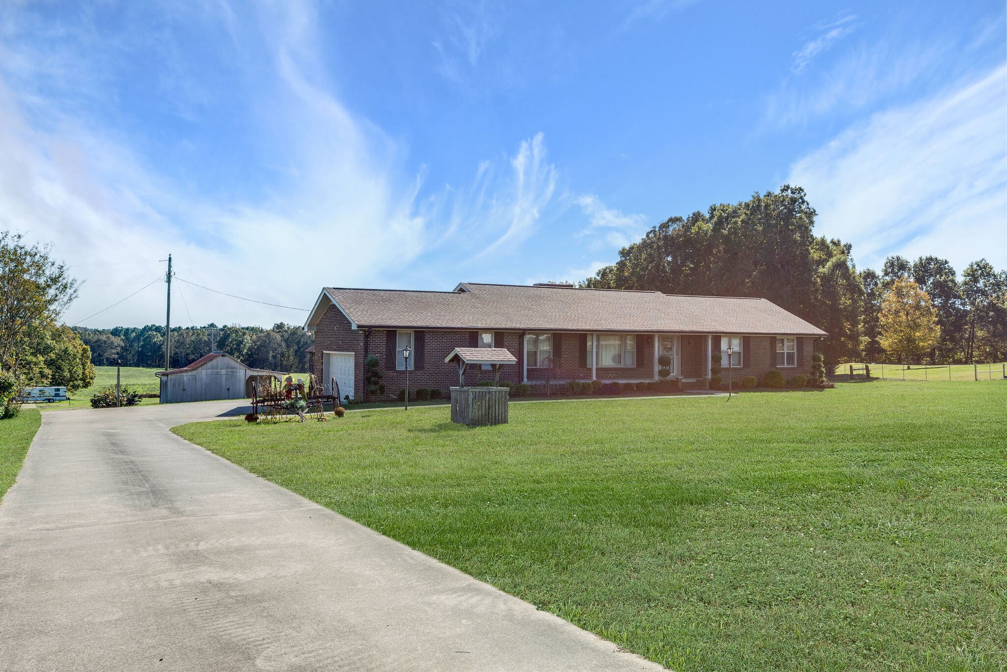 2154 Abiff Road Burns, TN 37029 - Photo 29 of 50 a view of a house with a big yard potted plants and large tree