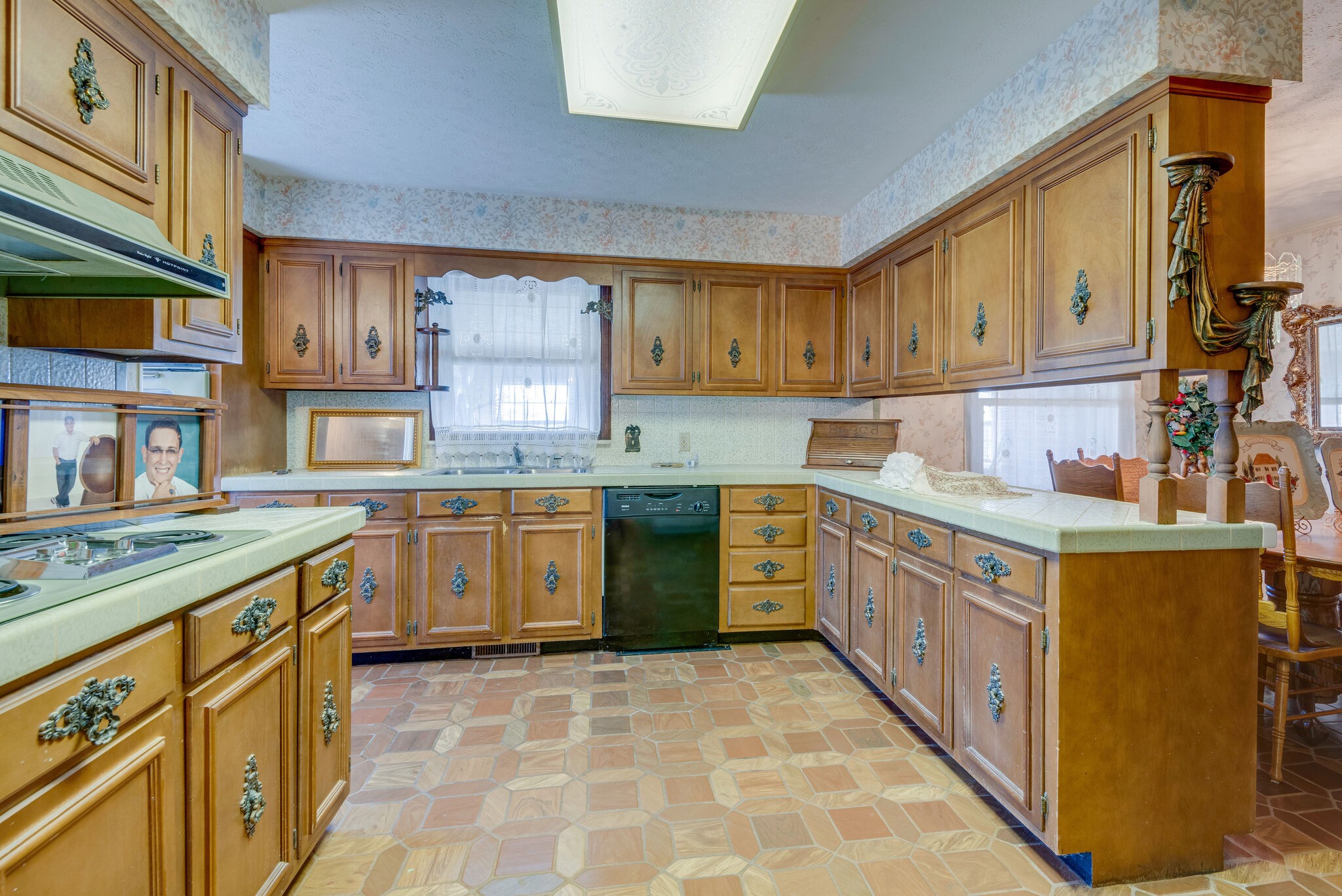 2154 Abiff Road Burns, TN 37029 - Photo 40 of 50 a kitchen with stainless steel appliances granite countertop a stove a sink dishwasher and a refrigerator