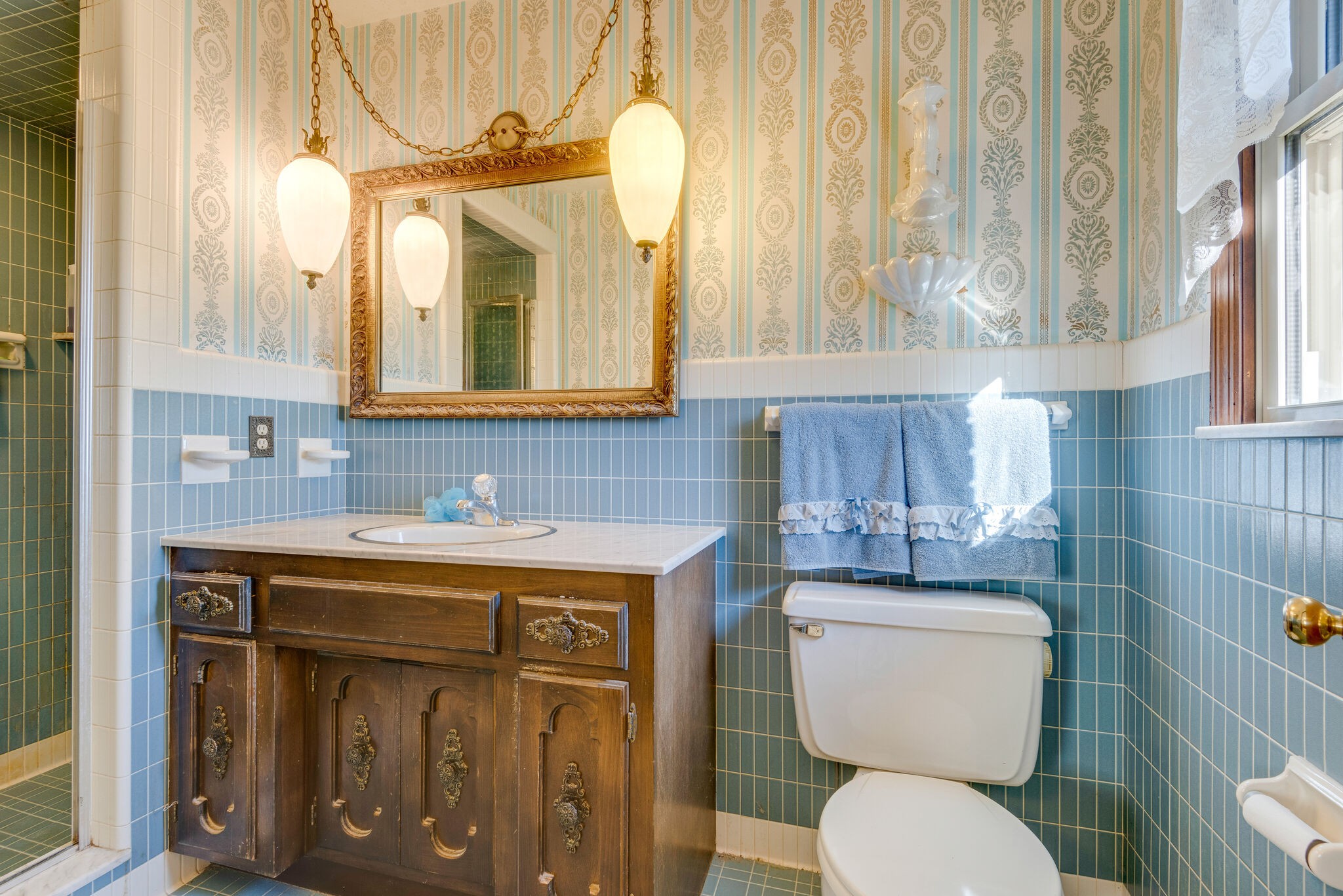 2154 Abiff Road Burns, TN 37029 - Photo 45 of 50 a bathroom with a toilet a sink and a mirror
