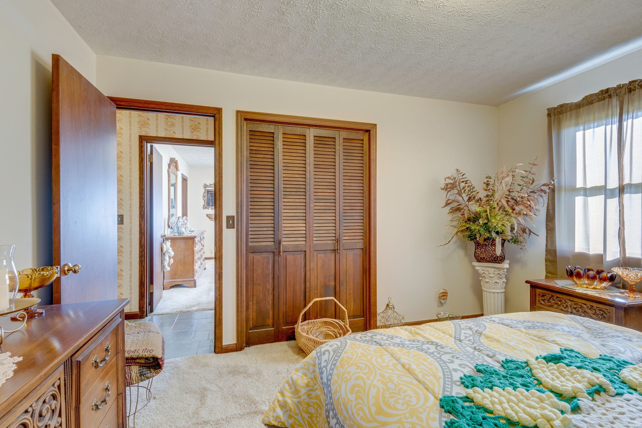 2154 Abiff Road Burns, TN 37029 - Photo 47 of 50 a bedroom with a bed and a potted plant