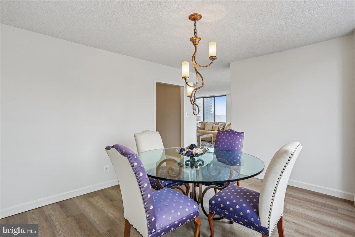 5225 Pooks Hill Road, Unit 629S Bethesda, MD 20814 - Photo 13 of 58 a view of a dining room with furniture and wooden floor