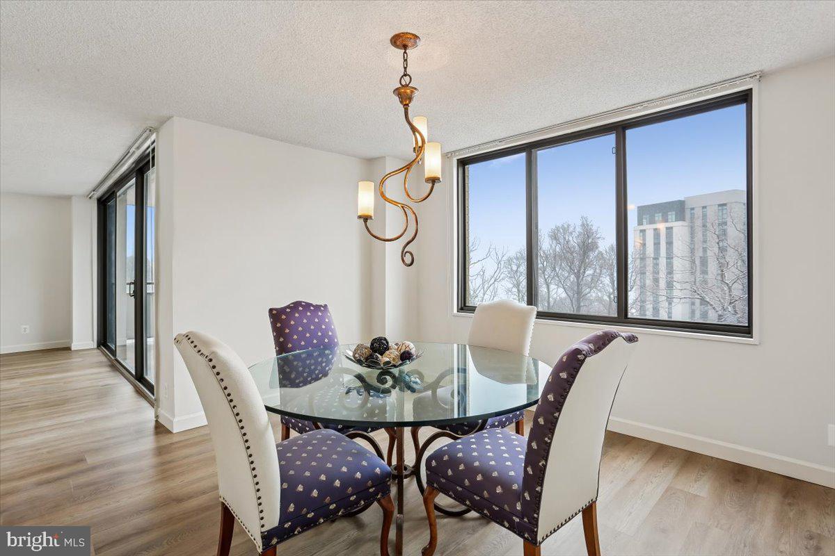 5225 Pooks Hill Road, Unit 629S Bethesda, MD 20814 - Photo 14 of 58 a view of a dining room with furniture window and wooden floor